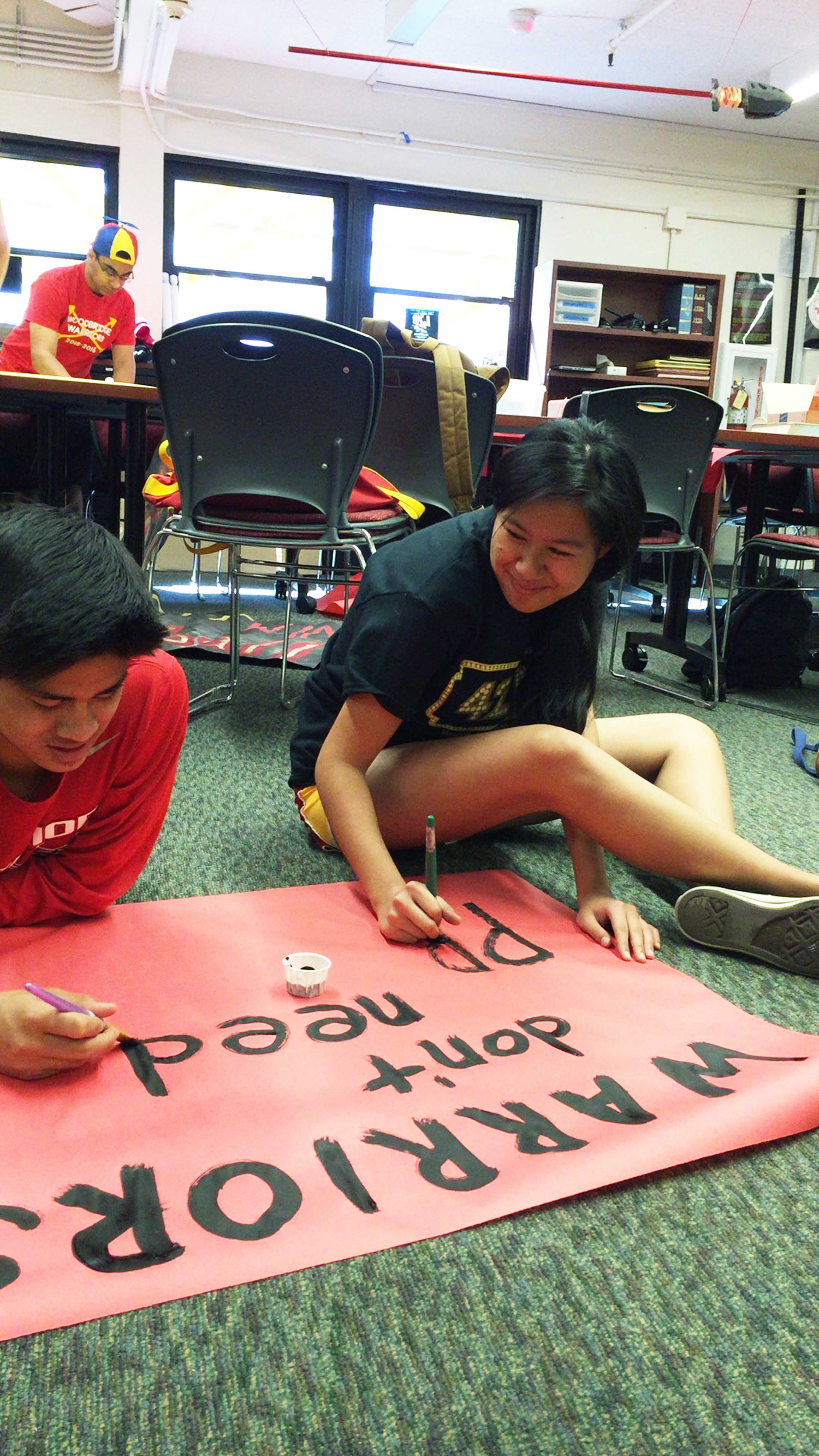 Samantha Kosai helps make poster to awaken warrior spirit for students around campus