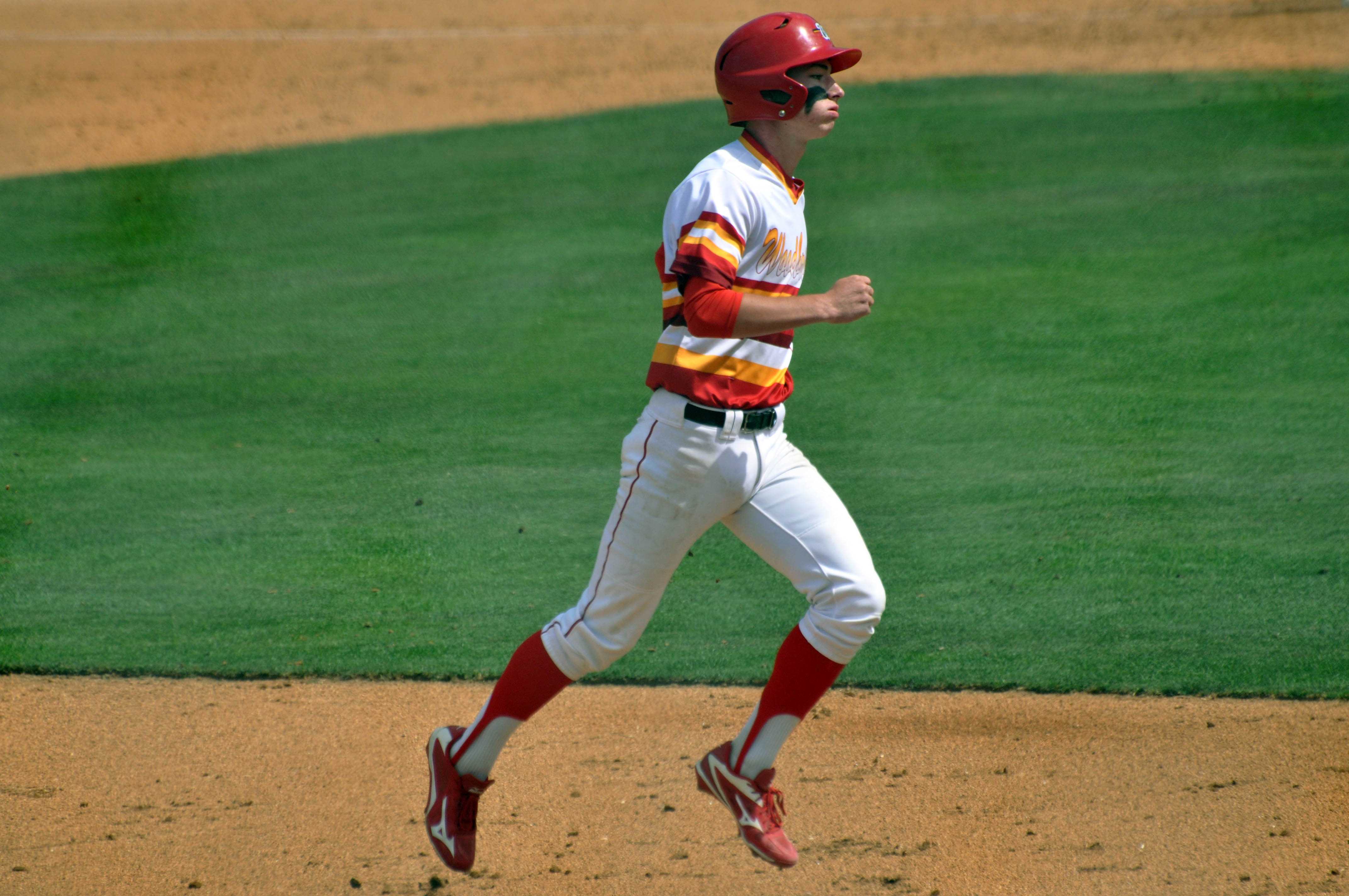 Center Fielder Sophomore Jackson LYon dashes to another base as he participates in the Pacific Coast League finals against Beckman High.