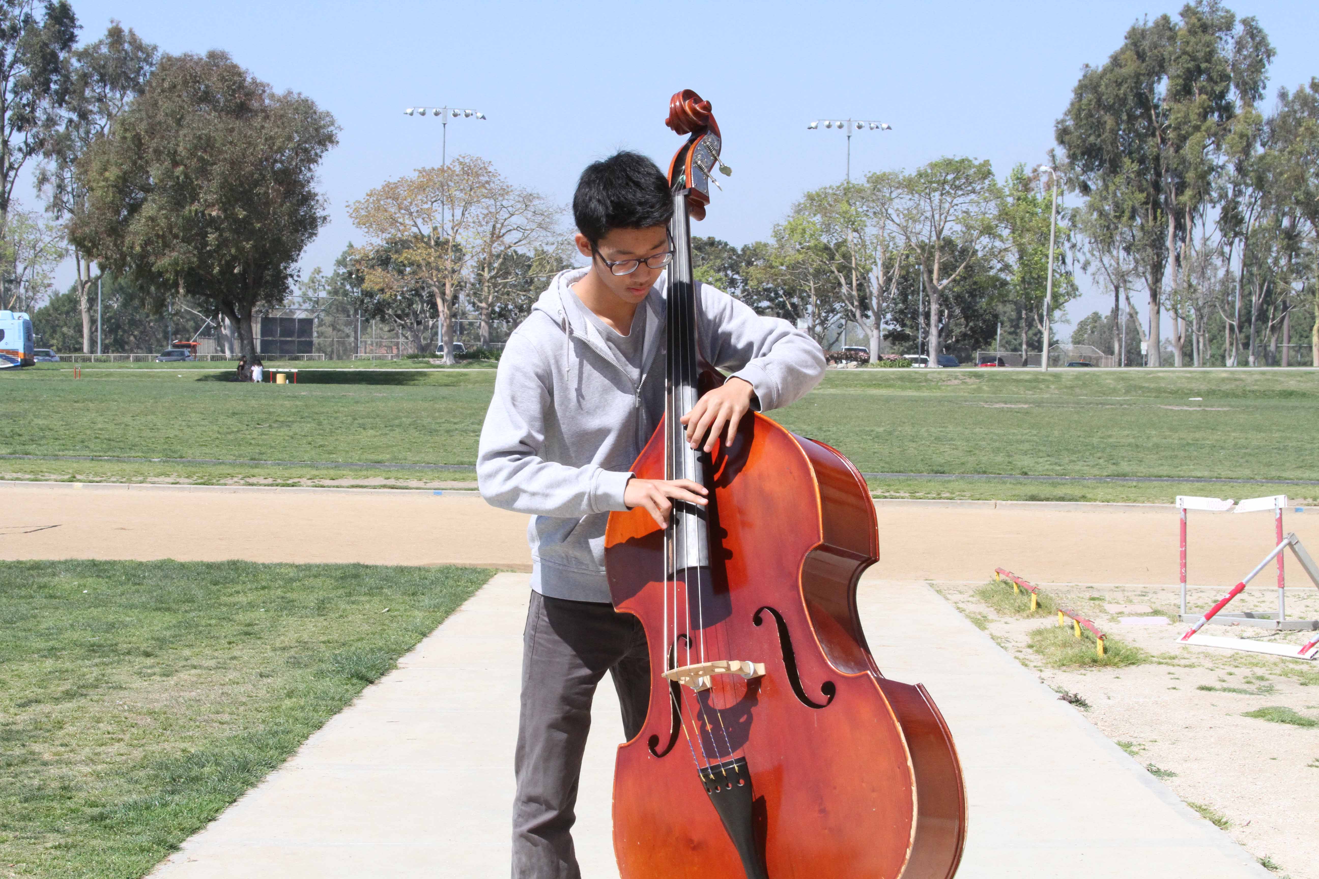 Sophomore Alphonse Oh dedicates long hours into mastering his skills on the bass and performance ability.