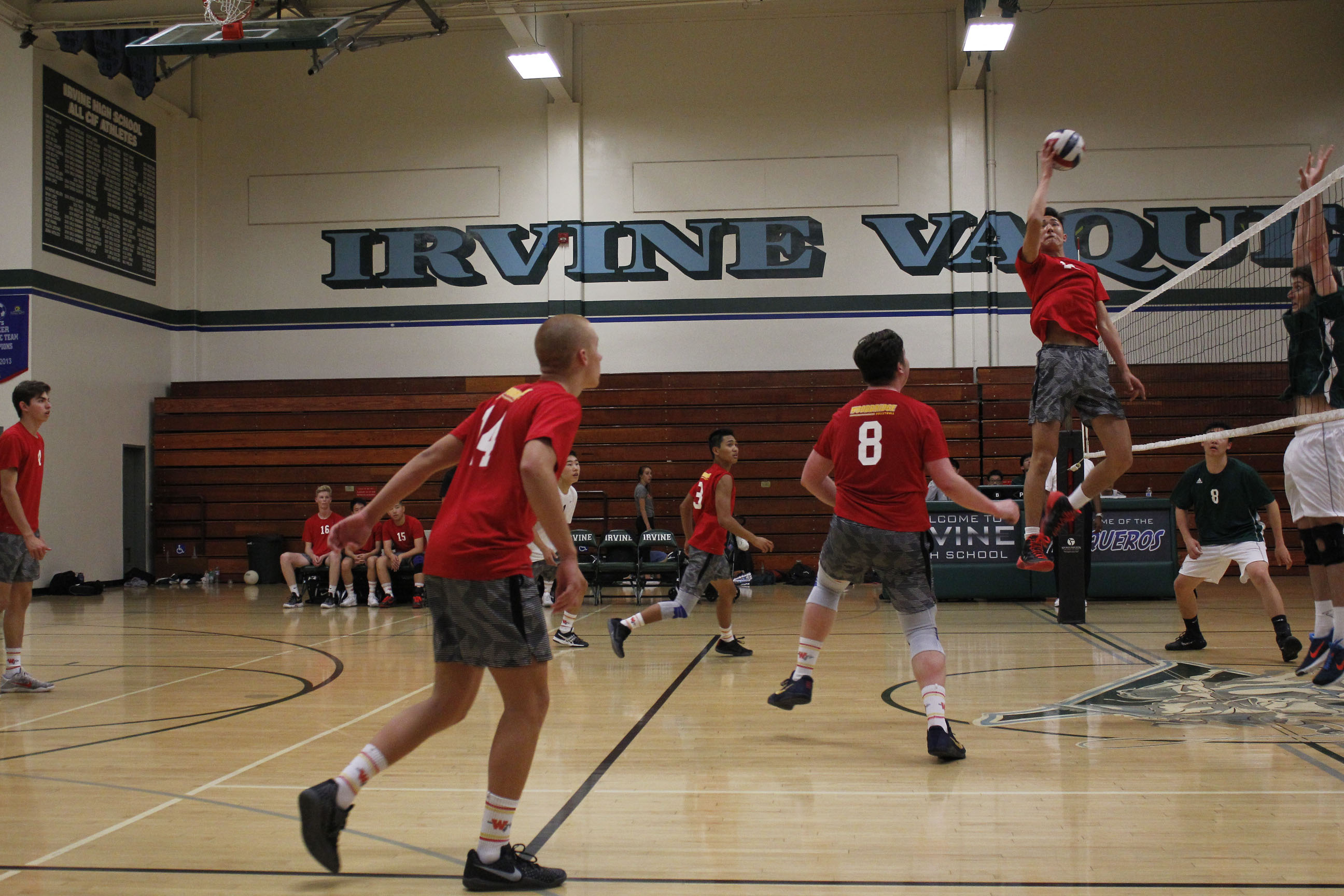 Seniors Guillermo Mier y Teran, Matt Meyers and Mitchell Lee rush to hit a ball against the Vaqueros.