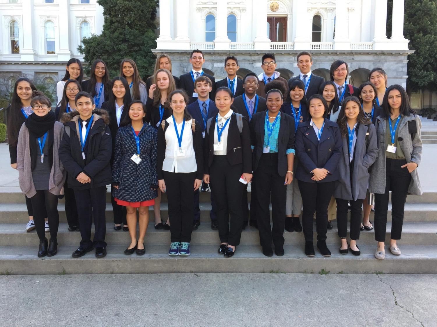 Students from the Irvine Unified School District gather together in front of the Capitol Building in Sacramento to discuss legislative impact on education.