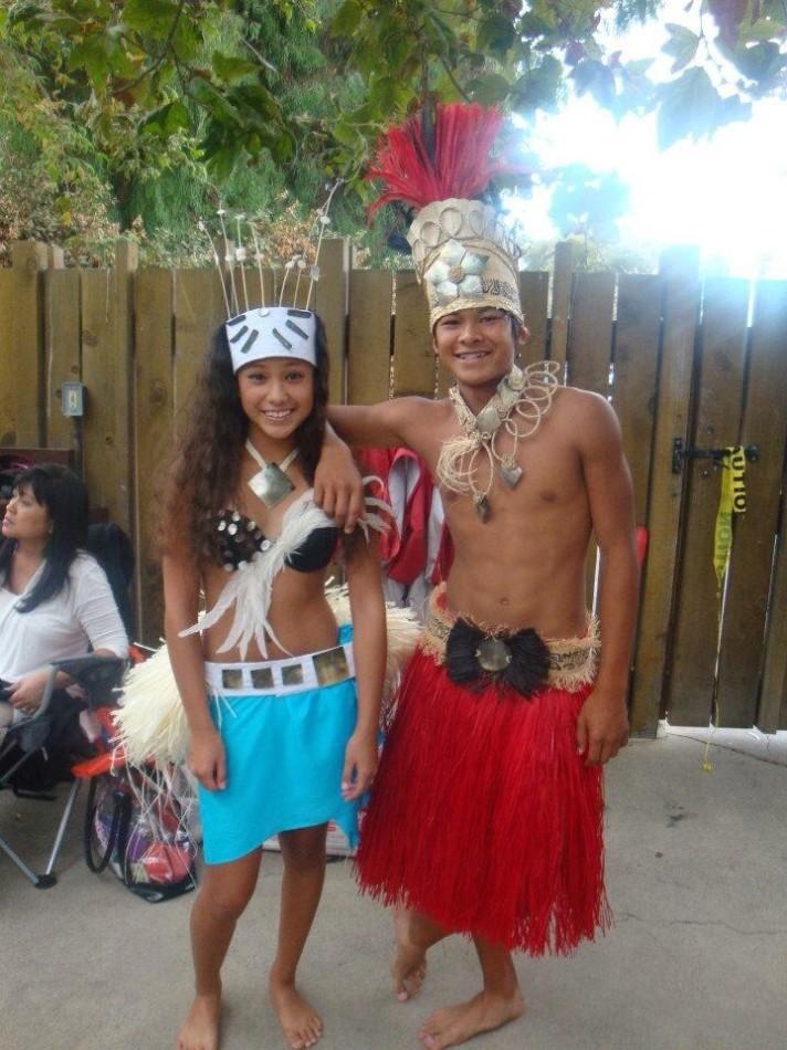 Junior Bon San Diego poses with sister Keola San Diego in their traditional Polynesian dance costumes.