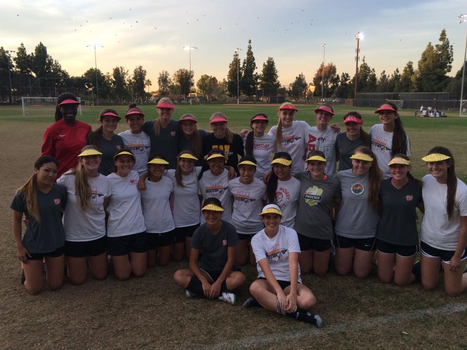The+girls+soccer+team+revels+in+its+victory+over+Newport+Harbor.+