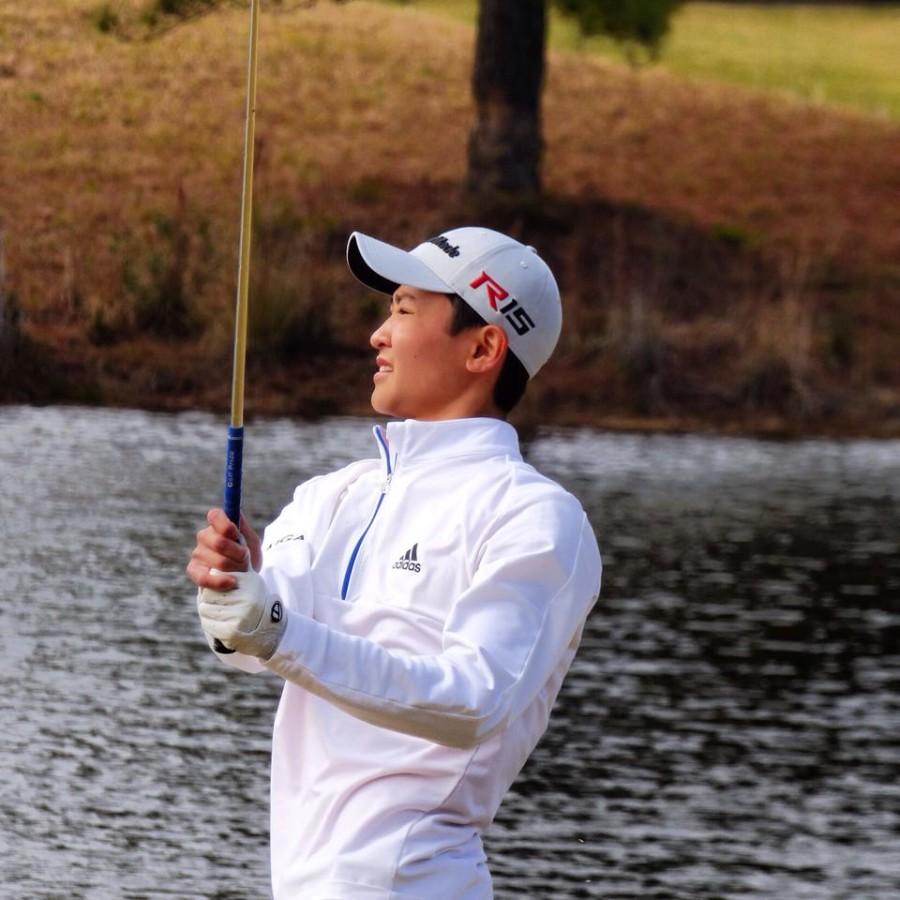 Junior Hidetoshi Yoshihara looks off after a swing at the National Junior Golf Tournament in Florida. 