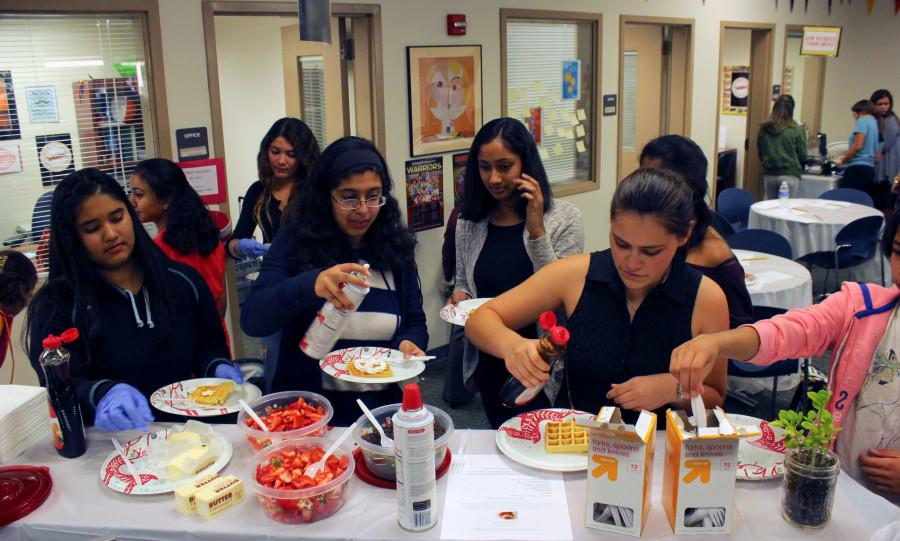 Students+enjoy+creating+and+eating+waffles+during+Wellness+Wednesday.+
