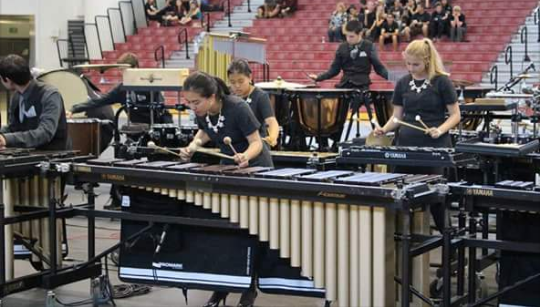 Senior Synie So performs onstage with percussion at the World Competition in Dayton, Ohio.