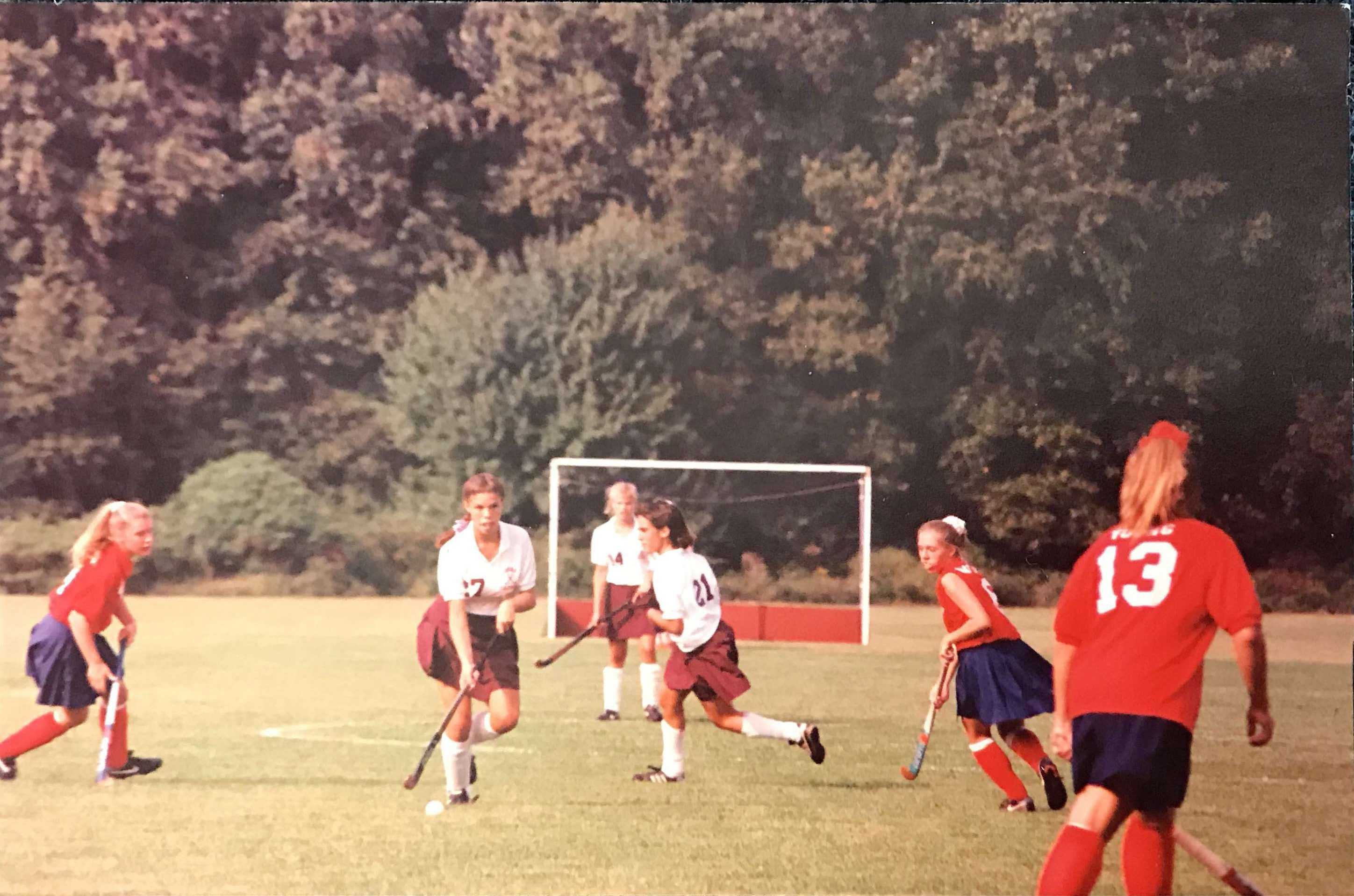 Laura Mattair (right-center) looks back on the days of field-hockey as a high school student-athlete.