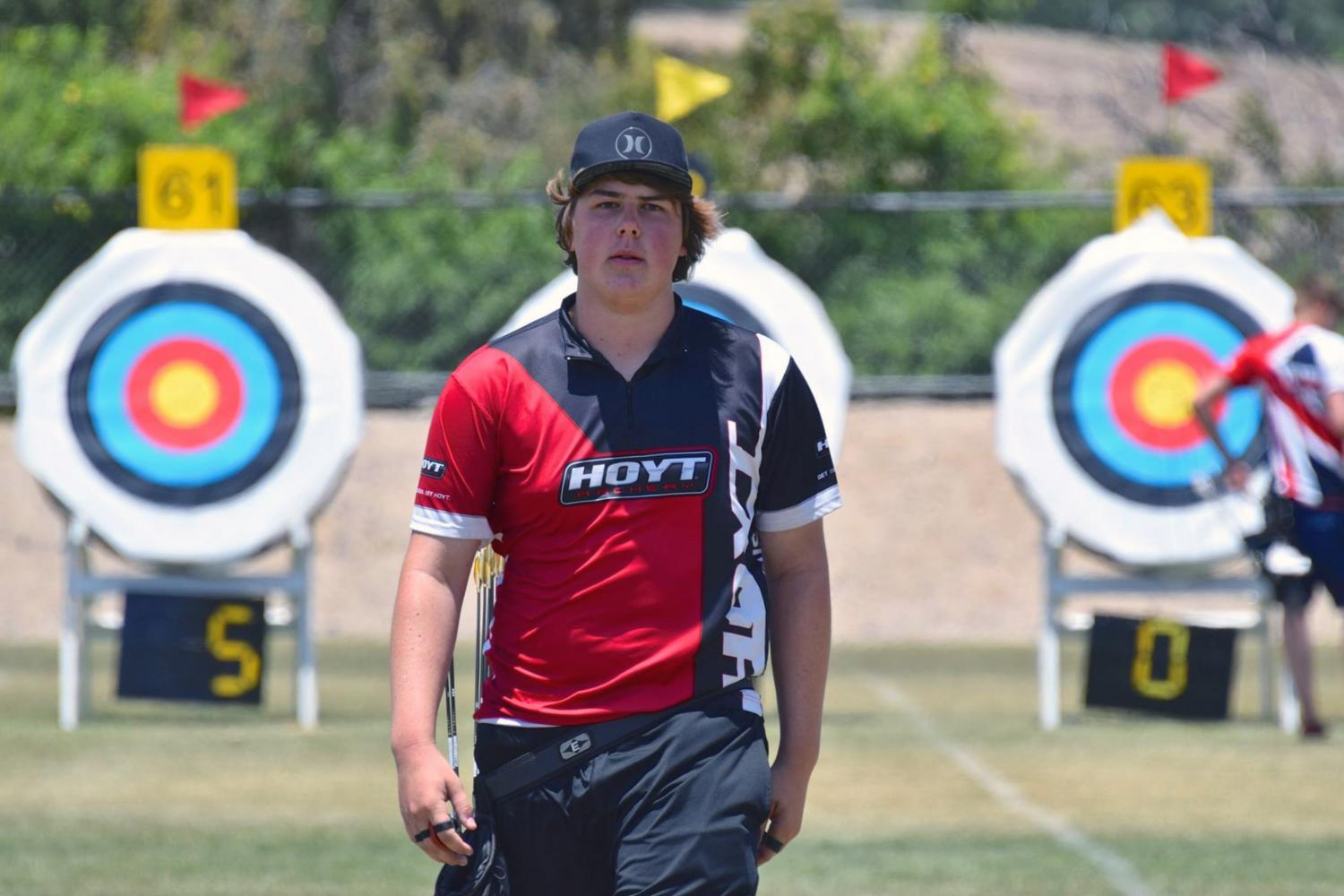 Olympic hopeful Jack Williams steadies his hands for a precise shot at the archery range, hoping to advance his archery career. 
