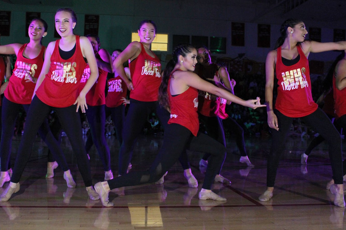 Dance team performs a routine that incorporates multiple styles of dance during the fall pep rally.