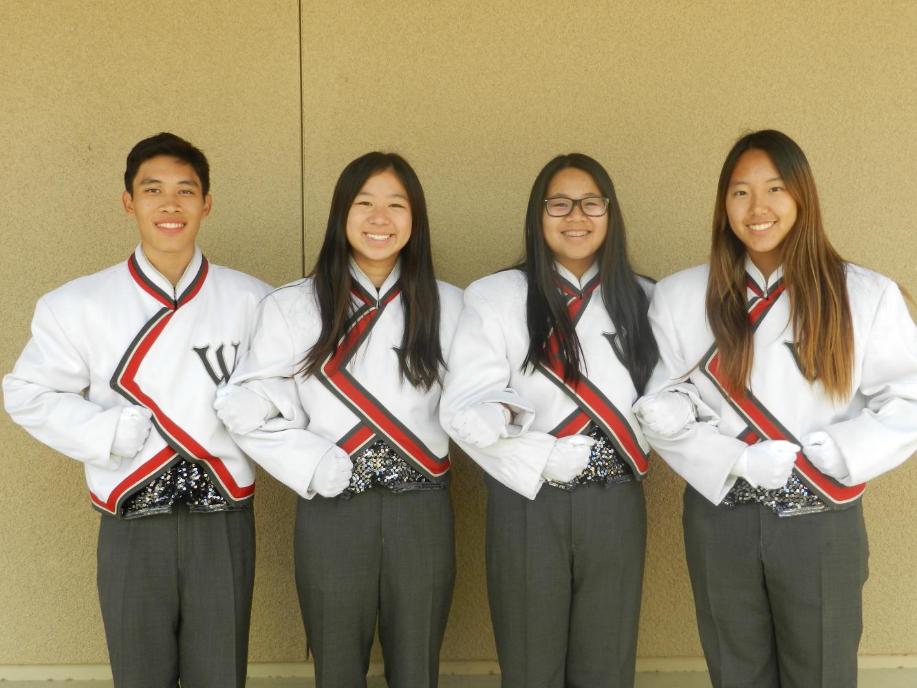 Senior drum majors (left to right) Malcolm Tsay, Jody Lin, Sabrina Wang, and Margaret Lee pose in in their distinct drum major uniforms.