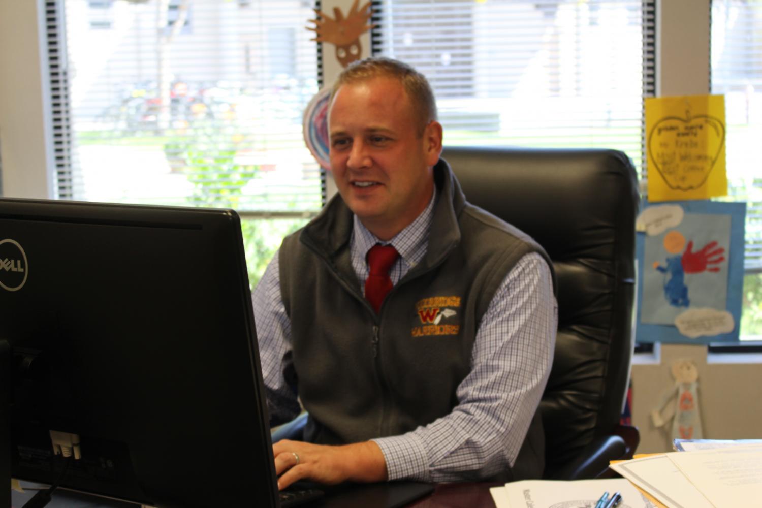 Principal Christopher Krebs leads the task force of students and staff to decide on a new bell schedule.