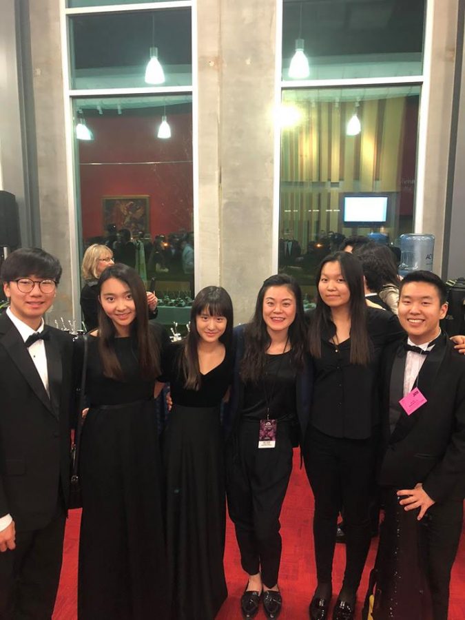 Students dress in formal black attire to unite through the National Orchestra performance. 