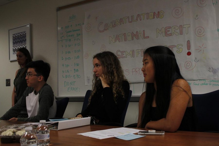 Seniors Ben Chang, Natalie Imshev and Emily Yu listen intently. 