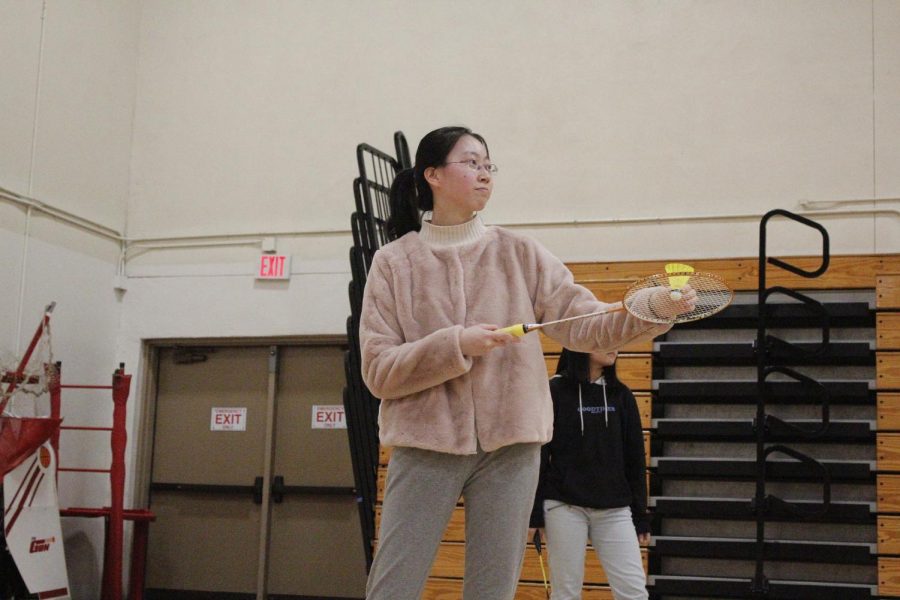 Junior+and+badminton+player+Julia+Yuan+prepares+to+serve+the+badminton+shuttlecock.