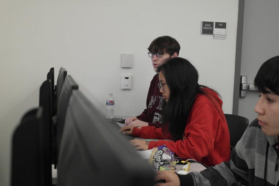 Sophomores Charlene Hui and Seth Ferrell compete at a cybersecurity competition.