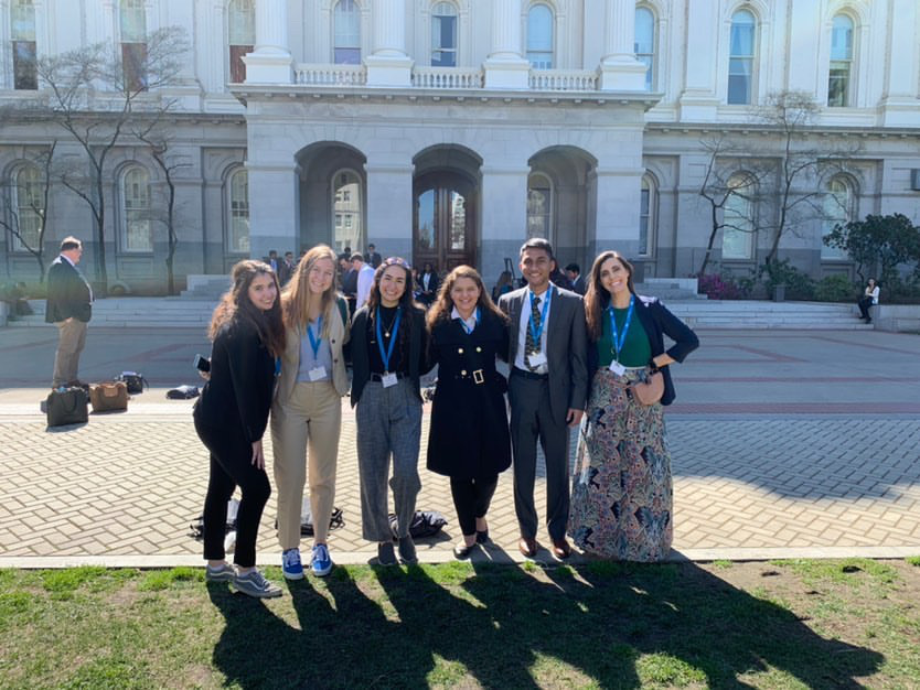 Woodbridge High advocates pose in front of the state capitol before they enter to advocate for policy changes.