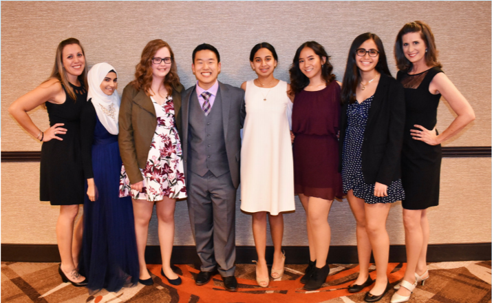 Senior John Cho (fourth from left) poses with his speech and debate team.