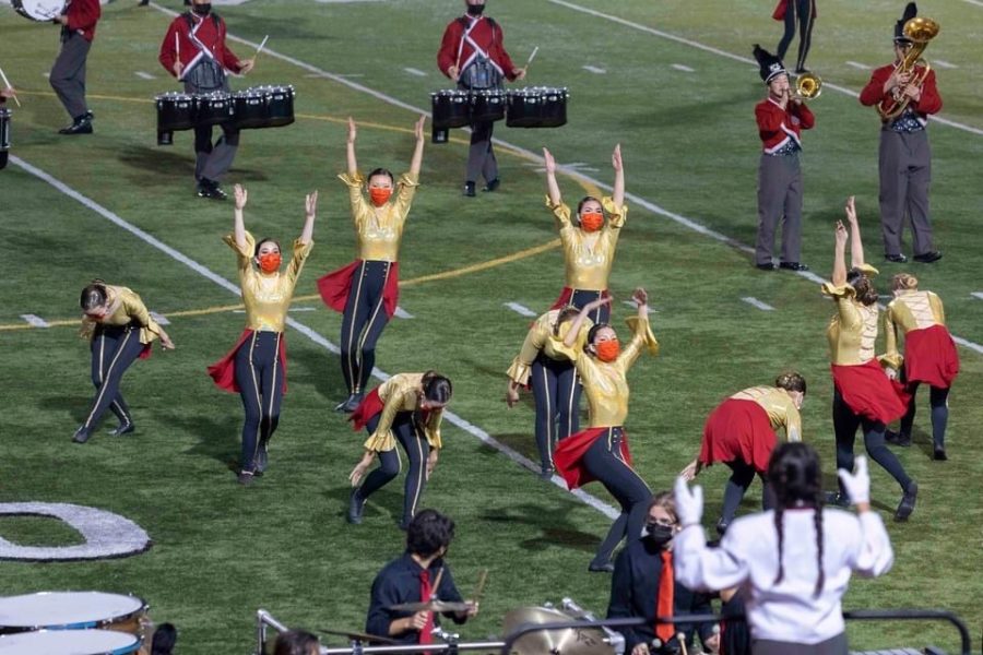Color+guard+performs+with+the+rest+of+Woodbridge+High+band+at+one+of+their+competitions.