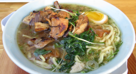 Shoyu Ramen, one of HiroNoris signature craft ramen topped with  spinach, bamboo, green onions and braised chicken.