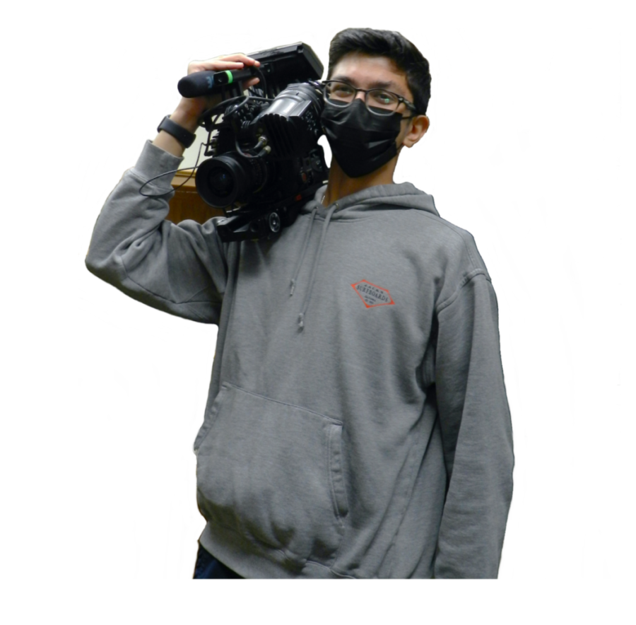Daniel Salameh gets a camera ready to film a WarriorTV episode.