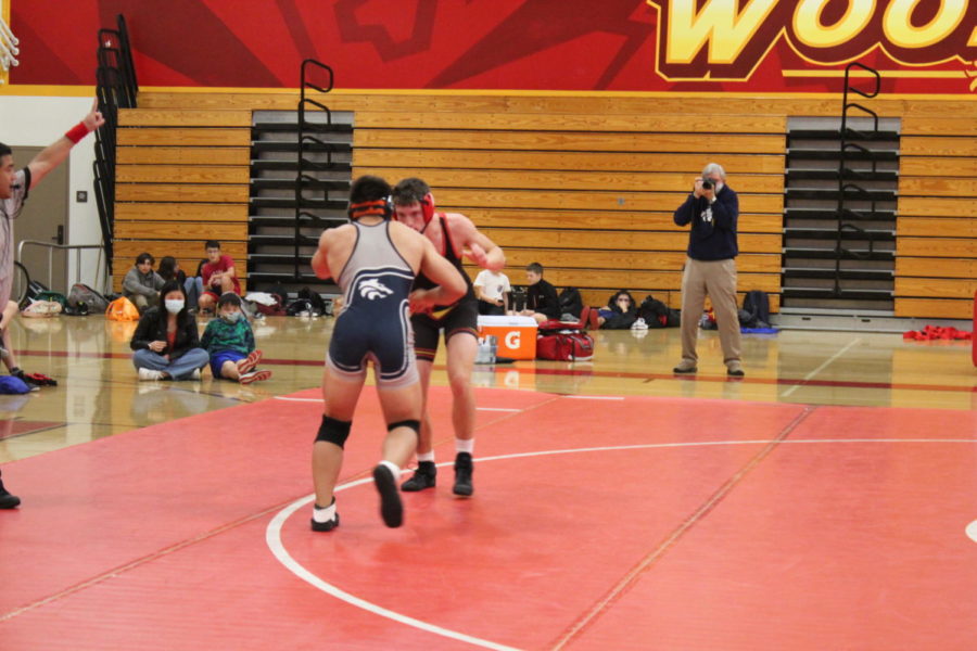 Varsity athlete Aiden Coleman wrestling against Northwood High in a match.  