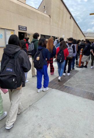 Students wait in the lunch line to receive their meal from the cafeteria.