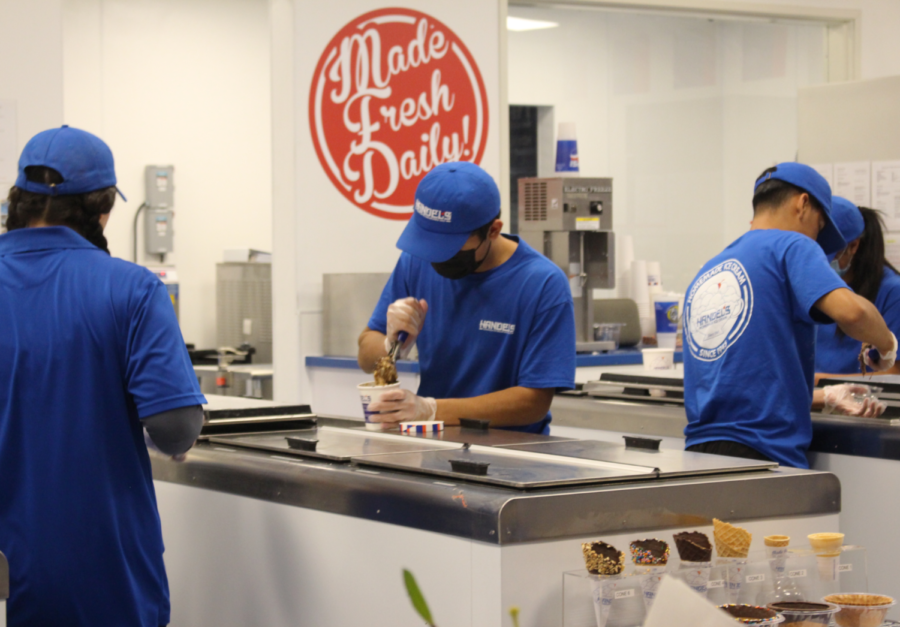 Newly hired Handels Ice Cream employees scoop fresh, homemade ice cream orders.

