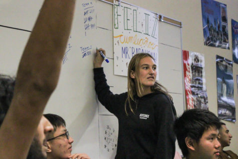 Turning Point USA club officer Sarah Kramer tallies members’ team scores for jeopardy.