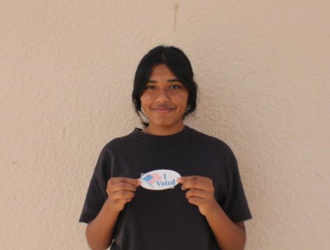 Ishana Das holds an “I Voted” sticker, signifying her first time participating in a political election.