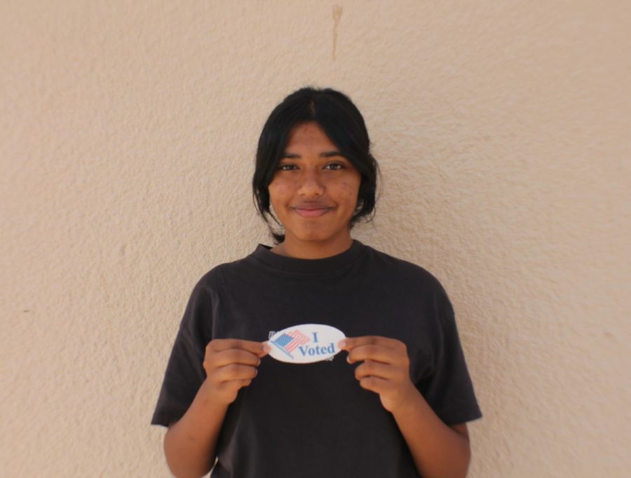 Ishana+Das+holds+an+%E2%80%9CI+Voted%E2%80%9D+sticker%2C+signifying+her+first+time+participating+in+a+political+election.