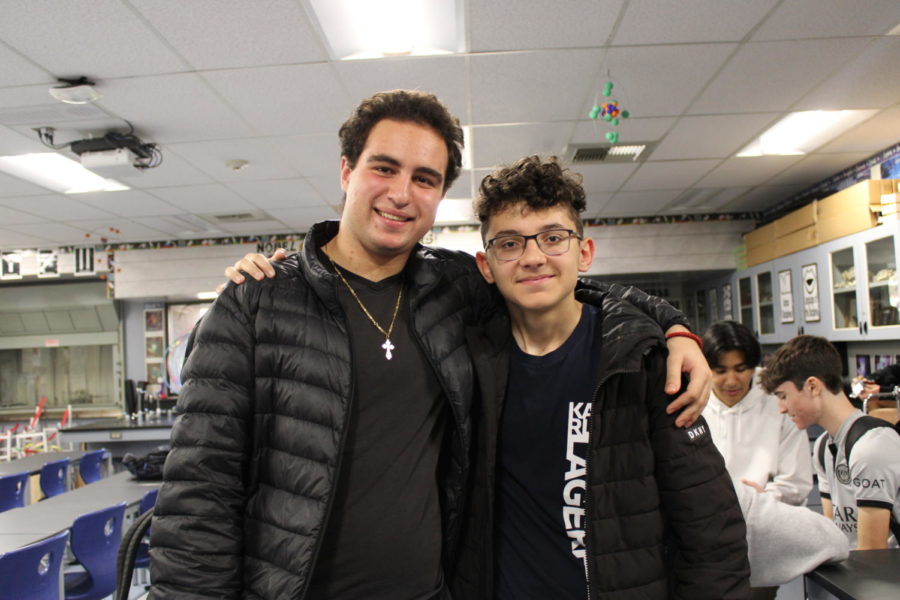 Footy Watch club board members Luka Krezovic and Kareem Al Harastani smile for a photo at their club meeting on Dec. 9, 2022.