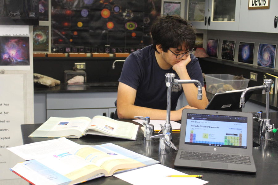 A team member works on a chemistry lab preparing for
the upcoming Science Olympiad.
