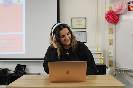 With her headphones on, junior Donya Yazdihan enjoys listening to music and reviewing albums.