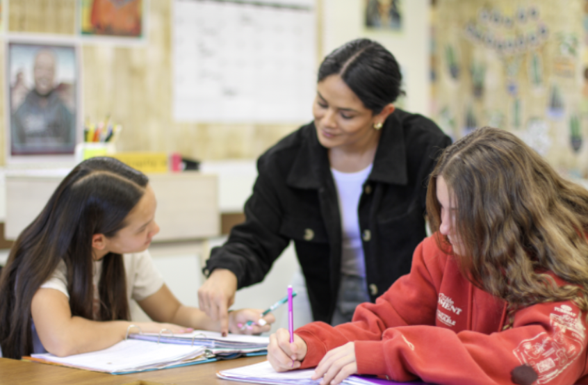 Students Rachel Harris and Sofia McPhail take on Woodbridge High’s new AVID program with teacher Elena Gonzalez.