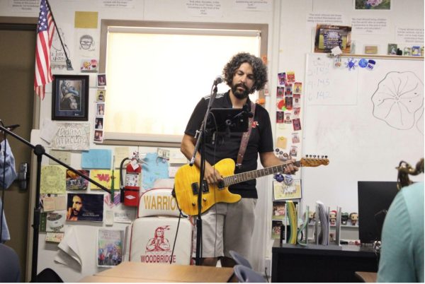 Mr. Atallah rehearsing with the band on his electric guitar.