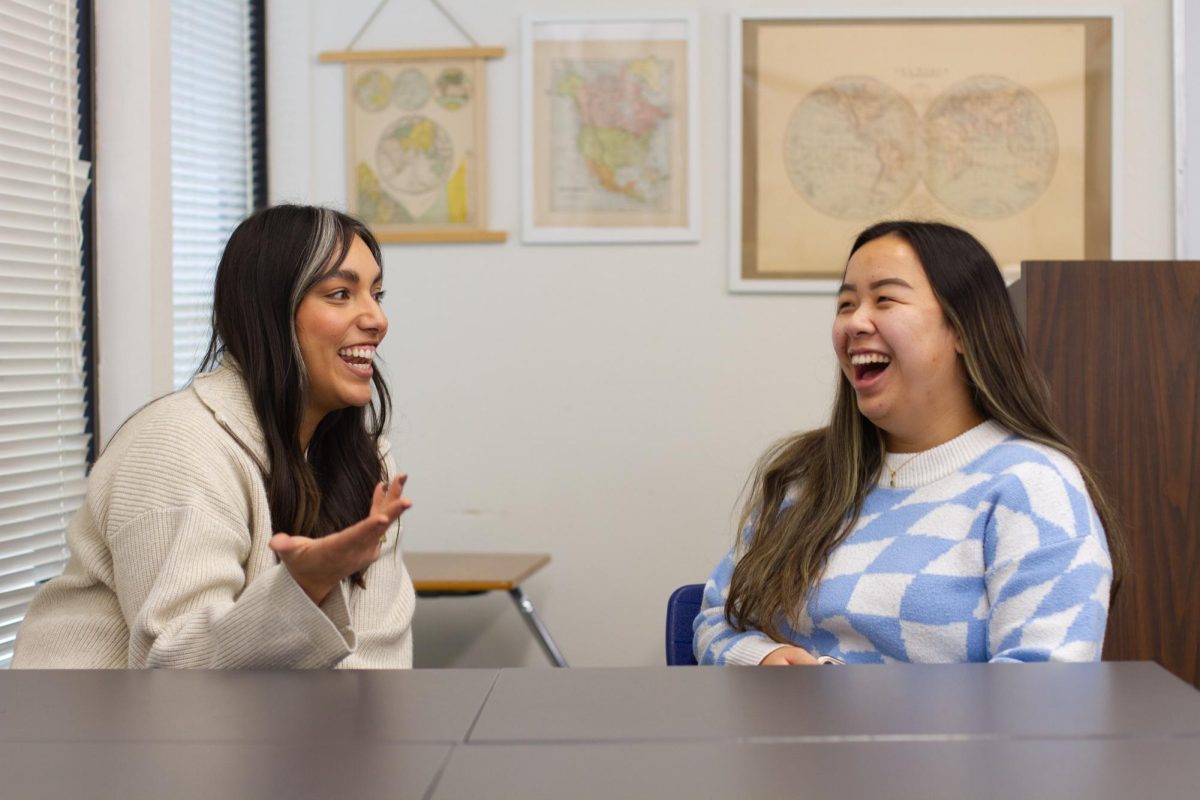 Committee members Vi Le and Alexandra Sheridan discuss future plans on how to make Woodbridge High a more inclusive environment for all ethnicities.
