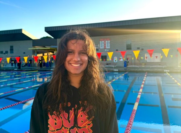 Senior Zara Masud smiles brightly at what she considers to be her second home: the pool.