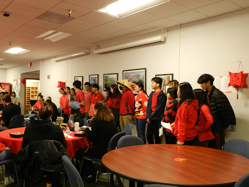 Students prepare to show different Chinese characters and explain their connections to the Lunar New Year. 