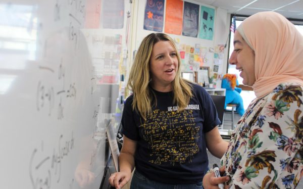 Math teacher Kristie Donavan assists senior Jana Elnashar with a differential equation during class.