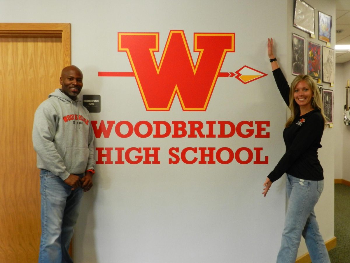 Principal Linzi Gorzycki and Assistant Principal Calvin McDonald pose in the front office of the Woodbridge High Administration Building.
