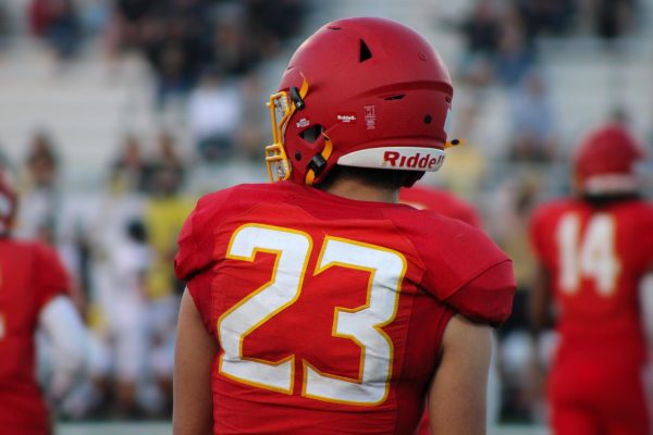 Senior Kai Tanaka on the field at a Friday night home game.