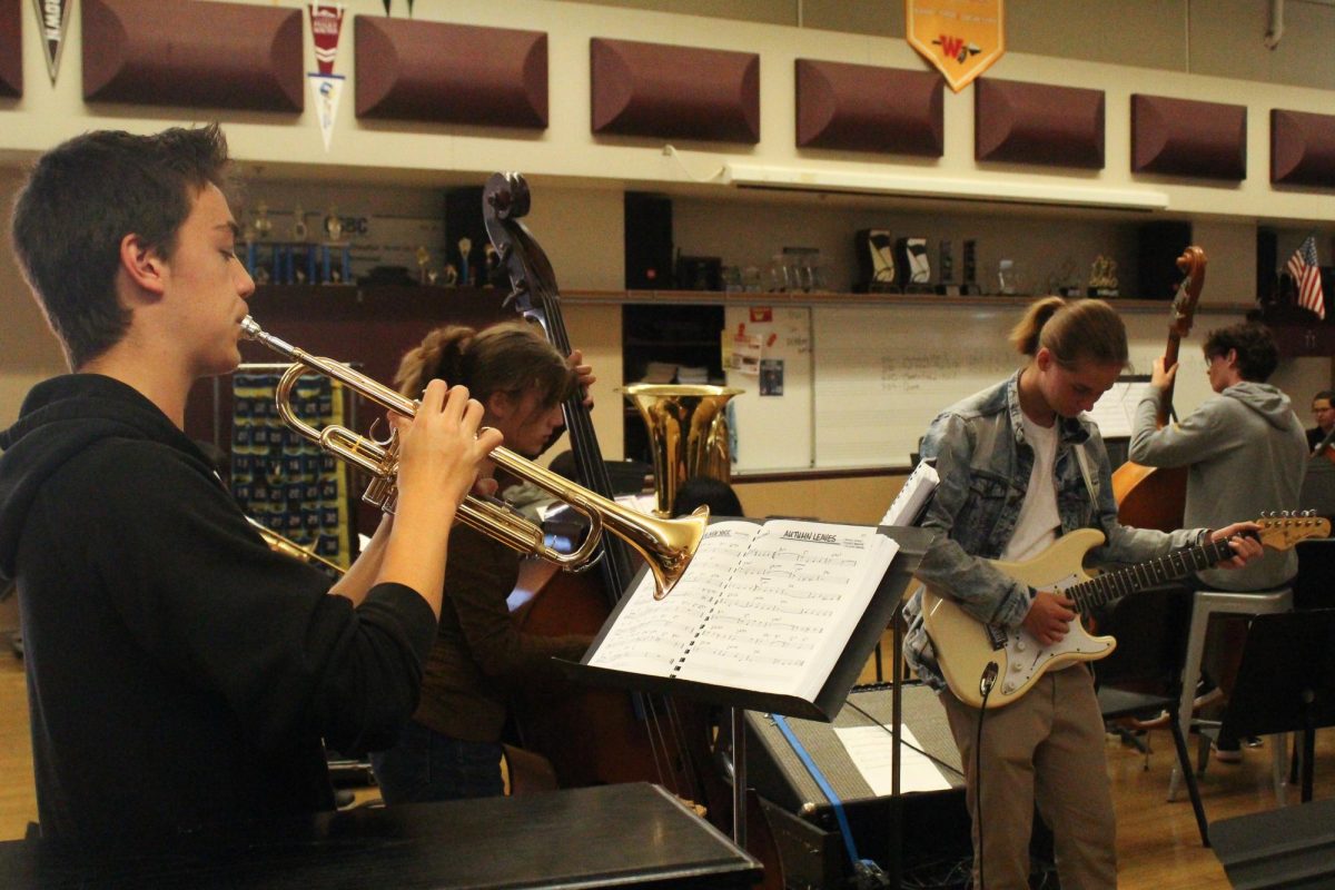 Ryan Robertson, Andrei Fedotor and Liv Thoennes practice a performance.