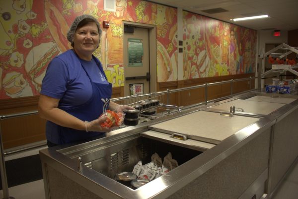 Nutrition services staff Ruta Kovalchuk prepares breakfast for Woodbridge High students in the morning.
