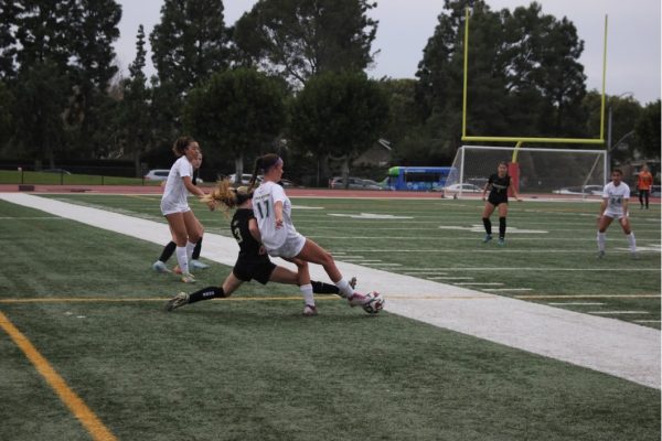 Woodbridge High’s Dyllan Harris (#3) slides in for a tackle during the non-league varsity soccer game against
Edison High on December 12, 2024, where Woodbridge earned a 1-0 victory.