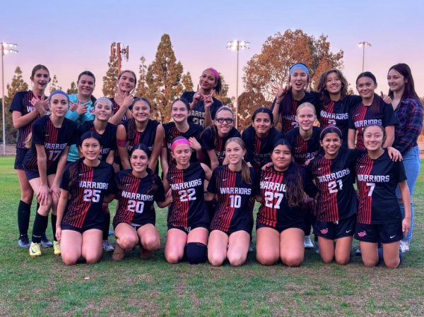 Junior varsity soccer team after a win against rival school
