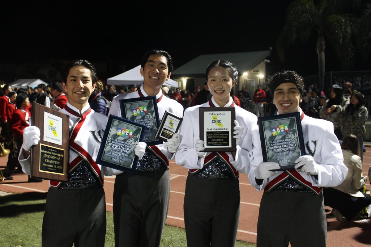 Woodbridge High’s Entertainment
Corps’ drum majors celebrate their first
place win at the California State Band
Championship.