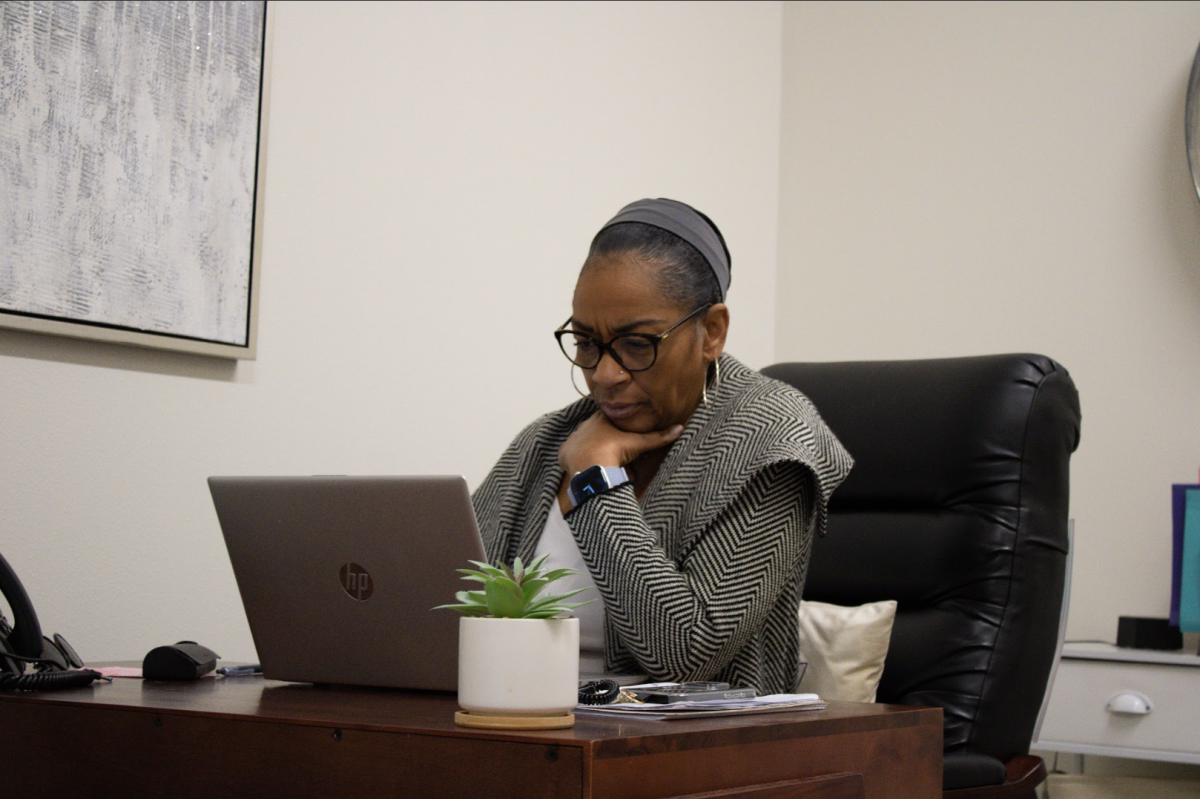 Uraci Mathews works diligently on the Project Success program at her desk.