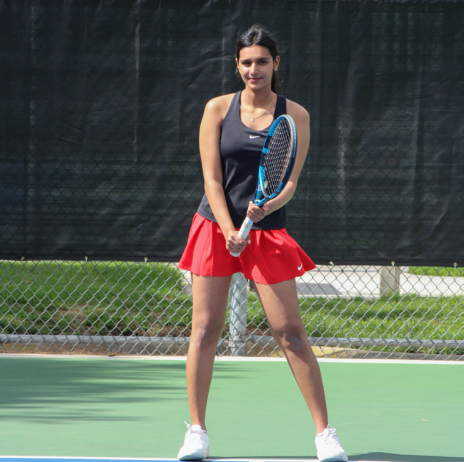 Senior Harini Suresh Kumar stands ready to receive a serve.