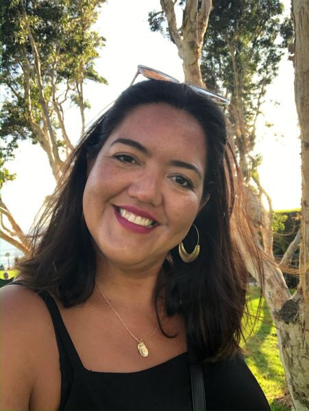 English Teacher Ruth Alix poses in the late summer sky. 