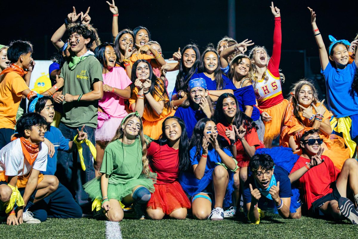Freshman homecoming skit dancers pose together after finishing their performance